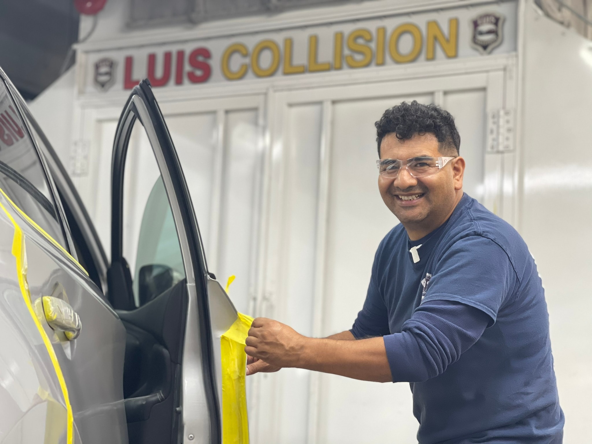 Vehicles on lifts inside a modern auto repair garage