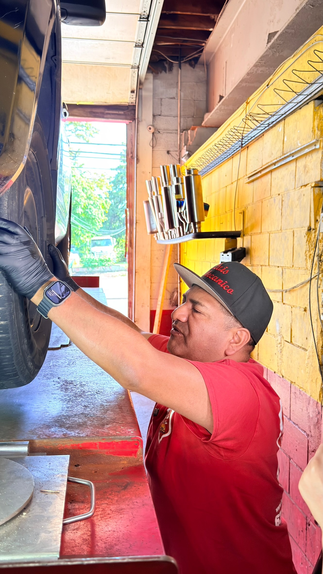 Luis Auto Repair technician servicing a customer vehicle
